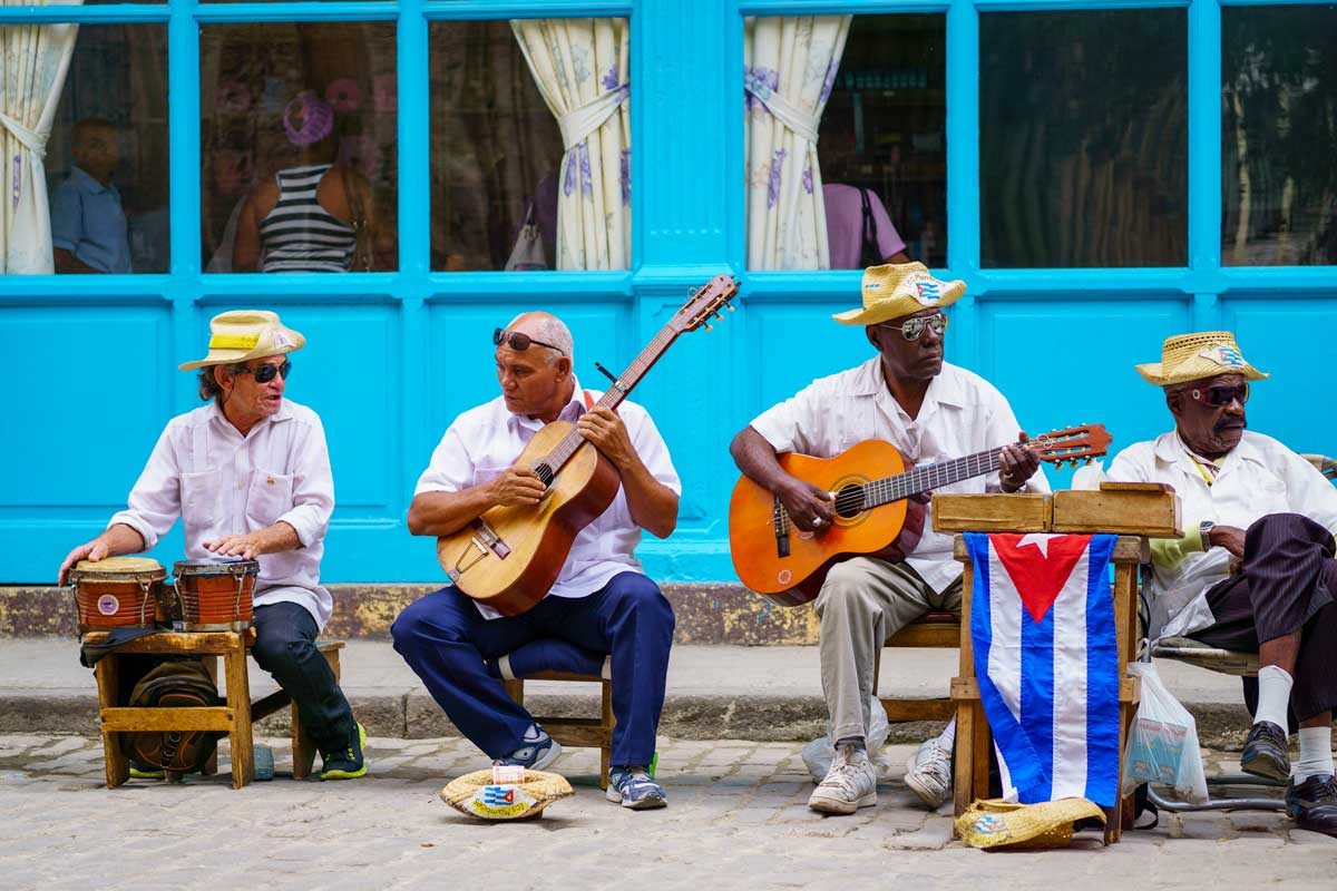 group af male musicians with guitars and drums
